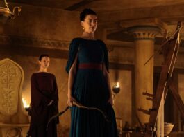 Mia Goth as Melantho and Anne Hathaway as Penelope in The Odyssey, directed by Christopher Nolan. Photo: Melinda Sue Gordon. Copyright: Universal Studios. All Rights Reserved.