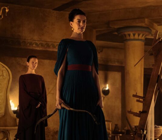 Mia Goth as Melantho and Anne Hathaway as Penelope in The Odyssey, directed by Christopher Nolan. Photo: Melinda Sue Gordon. Copyright: Universal Studios. All Rights Reserved.
