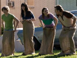 Christian Convery as Brian Platt, Anne Hathaway as Denise Platt, Maisy Stella as Audrey Platt and Ewan McGregor as Greg Platt in The End Of Oak Street, directed by David Robert Mitchell. Photo: Daniel McFadden. Copyright: Warner Bros. Entertainment Inc. All Rights Reserved.