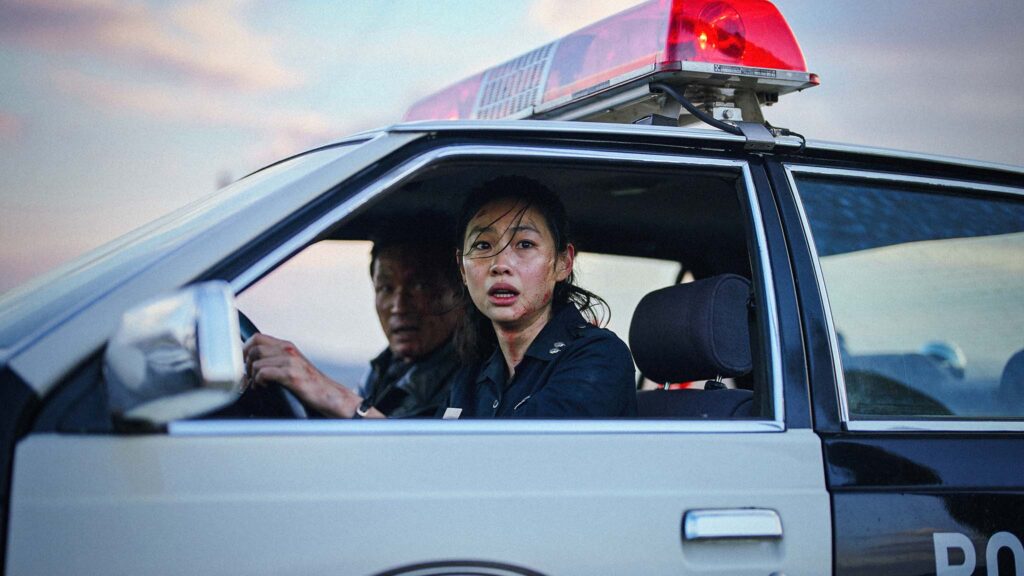 Hwang Jung-min as police chief Bum-seok and Hoyeon as police officer Sung-ae in Hope, directed by Na Hong-jin. Copyright: Neon//Picturehouse Entertainment. All Rights Reserved.