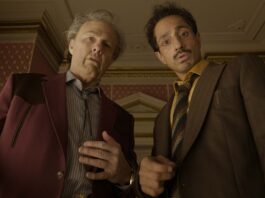 Tom Cruise as Rockwell and Riz Ahmed as Ganesh in Digger, directed by Alejandro González Iñárritu. Copyright: Warner Bros. Entertainment Inc. All Rights Reserved.